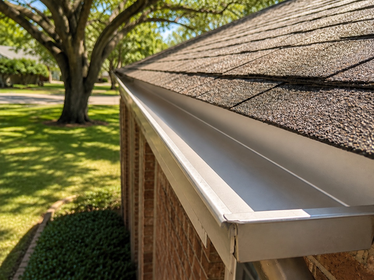 Clean, clear rain gutter after professional gutter cleaning in Dallas TX